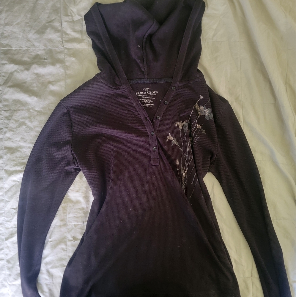 black hooded long sleeved shirt with flower detailing